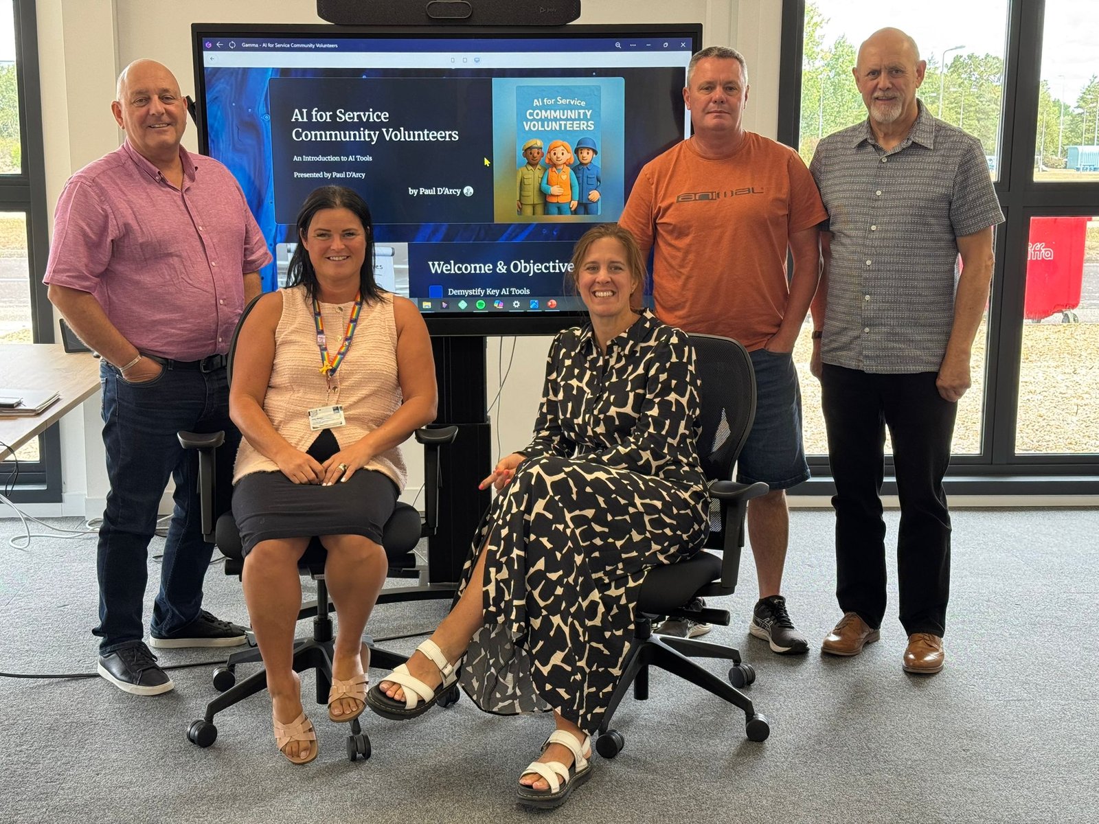 Paul D’Arcy with community volunteers during an AI tools session